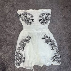 White strapless romper with black embroidered flowers